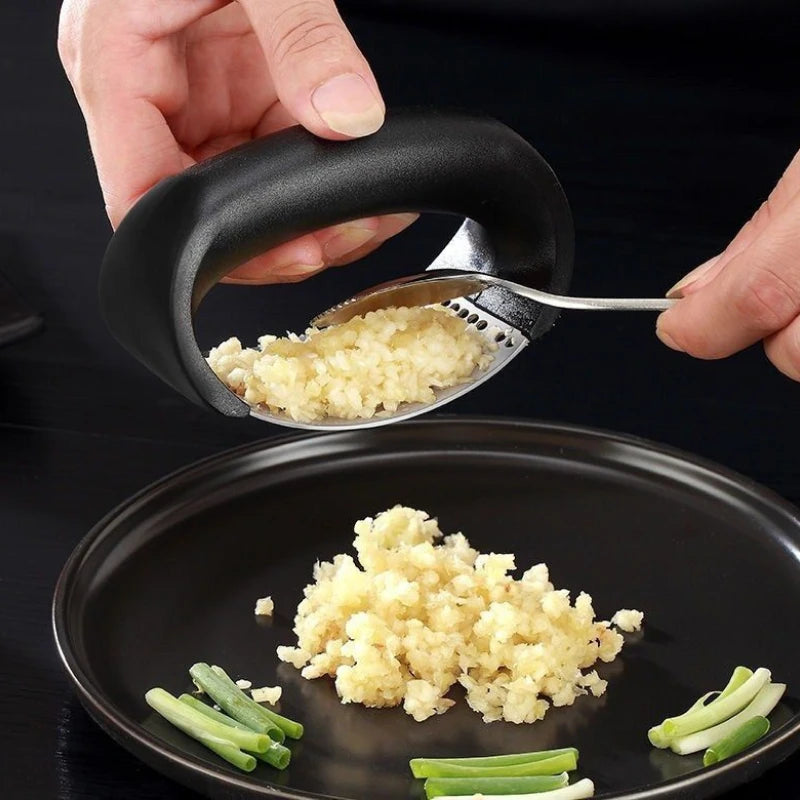 Ergonomic stainless steel garlic press for effortless garlic crushing